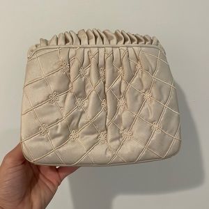 Vintage Judith Leiber evening bag; beige with gold tone chain straps.